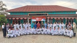Kades Agus Ropik Kukuhkan Pasukan Pengibar Bendera Merah Putih Desa Manunggal Jaya Rambang Niru 