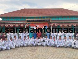 Kades Agus Ropik Kukuhkan Pasukan Pengibar Bendera Merah Putih Desa Manunggal Jaya Rambang Niru 